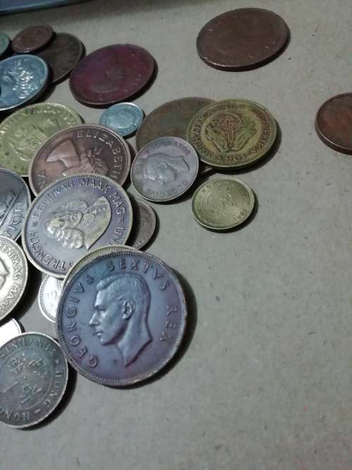 Toffee tin with mixed 120 international coins