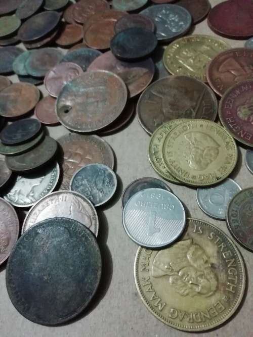 Toffee tin with mixed 120 international coins