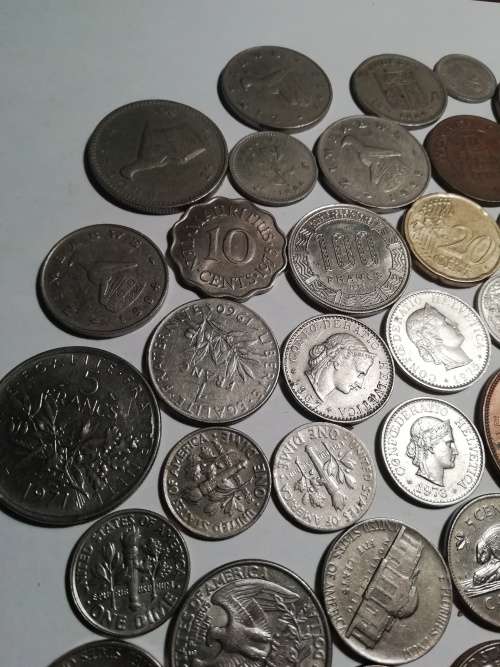 55 Mixed International coins. One bid for the lot