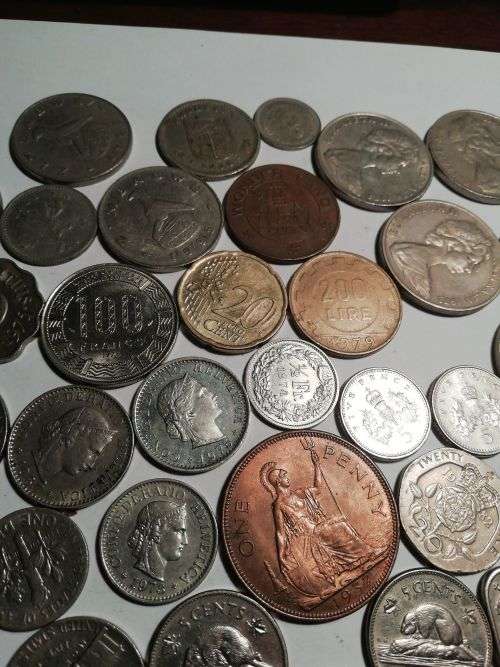 55 Mixed International coins. One bid for the lot