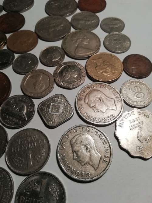 55 Mixed International coins. One bid for the lot