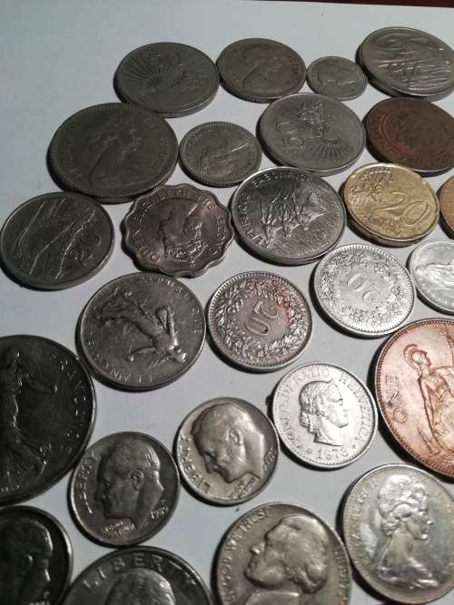 55 Mixed International coins. One bid for the lot