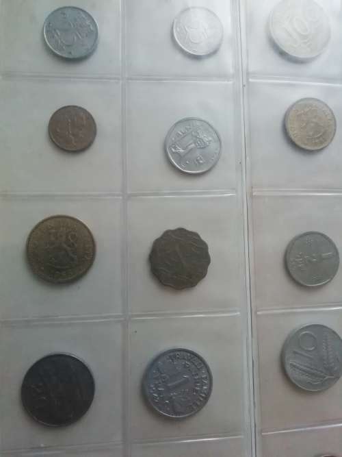 Bickels Coin Album with sleeves and 58 mixed coins.