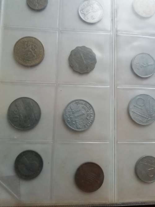 Bickels Coin Album with sleeves and 58 mixed coins.