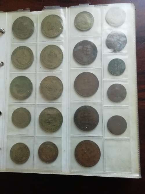 Bickels Coin Album with sleeves and 58 mixed coins.