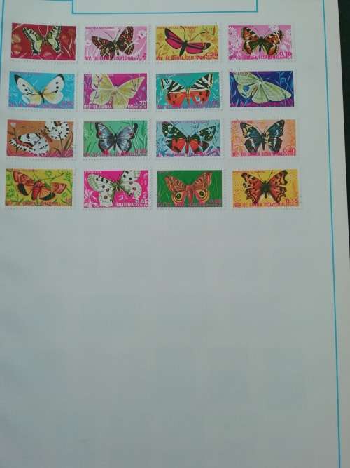 Stamp album, full of hinged stamps.