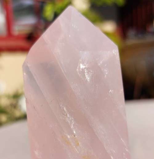 A 400G ROSE QUARTZ OBELISK WITH A 6 FACETTED POINT  CUT AND POLISHED IN ZAMBIA