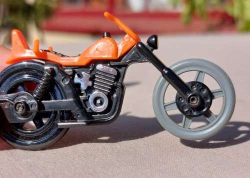 A POP CYCLE TYPE RIP CORD MOTORCYCLE  NO RIDER OR ZIP CORD