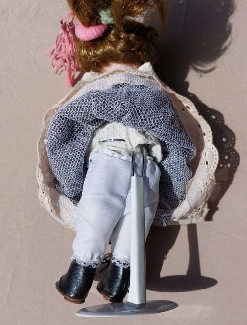 CUTE HIGH QUALITY PORCELAIN DOLL WITH BLUE EYES AND BIG EYELASHES ON STAND