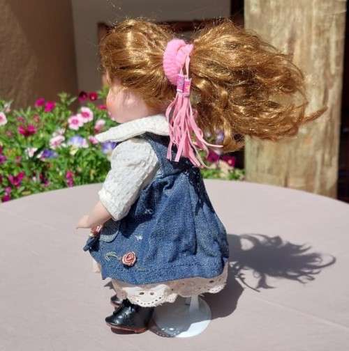 CUTE HIGH QUALITY PORCELAIN DOLL WITH BLUE EYES AND BIG EYELASHES ON STAND