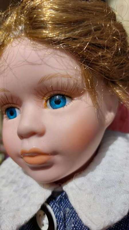 CUTE HIGH QUALITY PORCELAIN DOLL WITH BLUE EYES AND BIG EYELASHES ON STAND