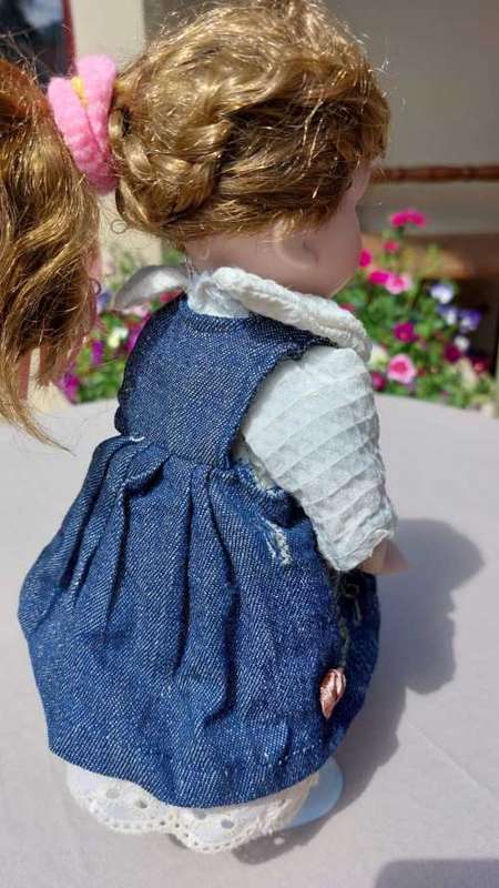 CUTE HIGH QUALITY PORCELAIN DOLL WITH BLUE EYES AND BIG EYELASHES ON STAND