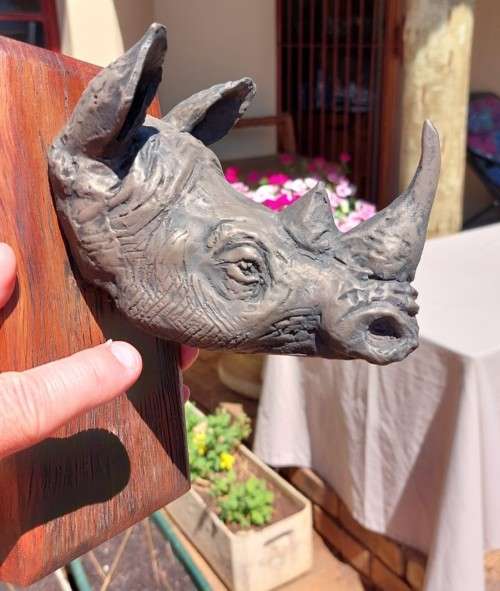 WHITE RHINO HENKMAM CLAY SCULPTURE WITH BRONZE COATING ON WOODEN WALL MOUNT