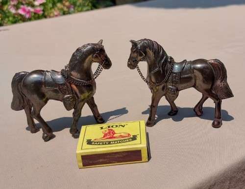 PAIR OF BRONZE OR COPPER COWBOY STYLE HORSES WITH BEADED CHAIN RAINS AND MOLDED SADDLES