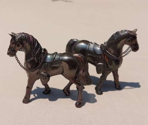 PAIR OF BRONZE OR COPPER COWBOY STYLE HORSES WITH BEADED CHAIN RAINS AND MOLDED SADDLES