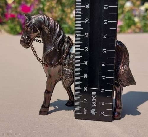 PAIR OF BRONZE OR COPPER COWBOY STYLE HORSES WITH BEADED CHAIN RAINS AND MOLDED SADDLES
