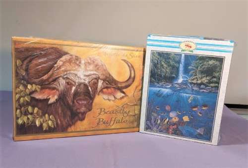 TWO PUZZLE BOXES  1500 PIECE BEASTLY BUFFALO  500 PIECE ISLAND OCEAN SCENE