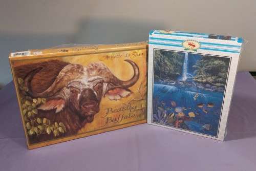 TWO PUZZLE BOXES  1500 PIECE BEASTLY BUFFALO  500 PIECE ISLAND OCEAN SCENE