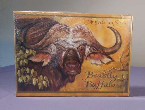 TWO PUZZLE BOXES  1500 PIECE BEASTLY BUFFALO  500 PIECE ISLAND OCEAN SCENE