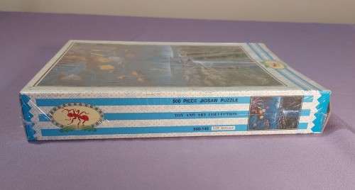 TWO PUZZLE BOXES  1500 PIECE BEASTLY BUFFALO  500 PIECE ISLAND OCEAN SCENE