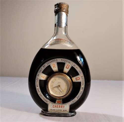 KAISER W GERMAN CLOCK (WORKING) IN AN 60 YEAR OLD! ITALIAN CHERRY WINE BOTTLE (FULL) ULTRA RARE