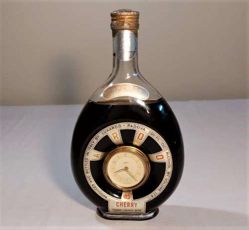 KAISER W GERMAN CLOCK (WORKING) IN AN 60 YEAR OLD! ITALIAN CHERRY WINE BOTTLE (FULL) ULTRA RARE