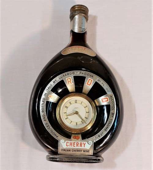 KAISER W GERMAN CLOCK (WORKING) IN AN 60 YEAR OLD! ITALIAN CHERRY WINE BOTTLE (FULL) ULTRA RARE