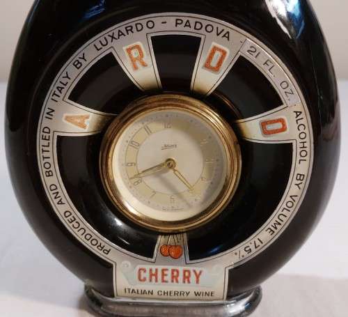 KAISER W GERMAN CLOCK (WORKING) IN AN 60 YEAR OLD! ITALIAN CHERRY WINE BOTTLE (FULL) ULTRA RARE
