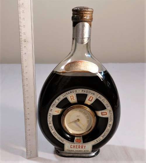 KAISER W GERMAN CLOCK (WORKING) IN AN 60 YEAR OLD! ITALIAN CHERRY WINE BOTTLE (FULL) ULTRA RARE