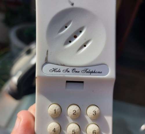 HOLE IN ONE MINIATURE (25CM HIGH) GOLF BAG PHONE WITH CLUBS AND WHEELS