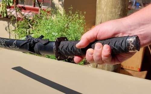 SAMURAI WAKIZASHI SWORD WITH DRAGON MOTIF DECORATED GUARD AND SCABBARD - 80CM LONG