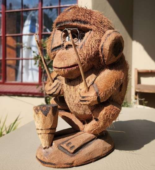 CUTE COCONUT MONKEY PLAYING DRUMS
