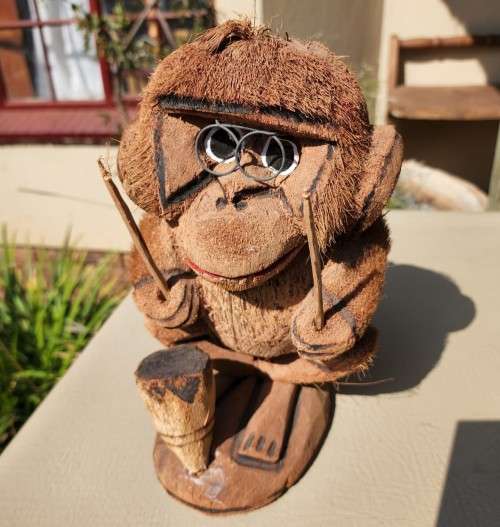 CUTE COCONUT MONKEY PLAYING DRUMS