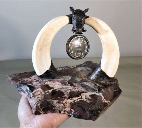 STRIKING WARTHOG TUSKS MOUNTED POCKET WATCH STAND WITH POSSIBLE SILVER MASQUE (WATCH NOT INCLUDED)