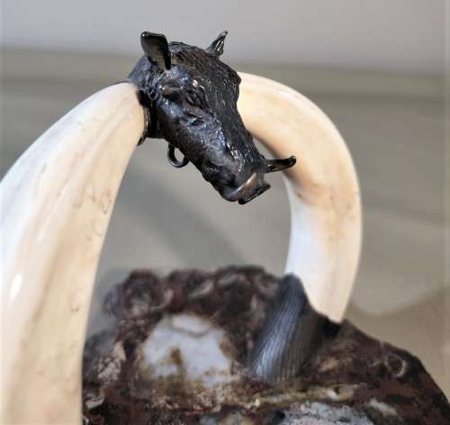 STRIKING WARTHOG TUSKS MOUNTED POCKET WATCH STAND WITH POSSIBLE SILVER MASQUE (WATCH NOT INCLUDED)
