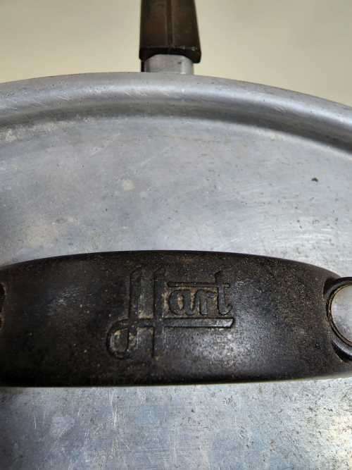 AN OLD TRIANGULAR HART SA MADE ALUMINIUM COOKING POT