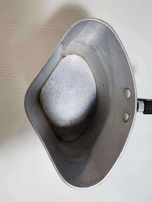 AN OLD TRIANGULAR HART SA MADE ALUMINIUM COOKING POT