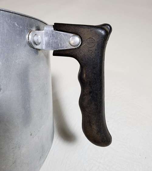 AN OLD TRIANGULAR HART SA MADE ALUMINIUM COOKING POT