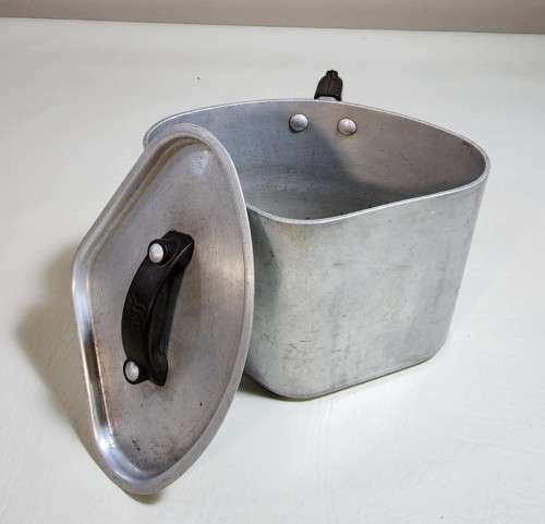 AN OLD TRIANGULAR HART SA MADE ALUMINIUM COOKING POT