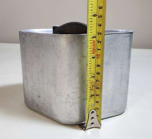 AN OLD TRIANGULAR HART SA MADE ALUMINIUM COOKING POT
