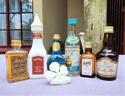 COLLECTION OF SIXTEEN (16) MINIATURE LIQUOR BOTTLES (MOST ARE FULL, SOME 75% FULL)