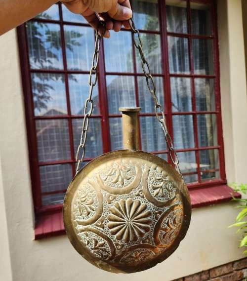 A VINTAGE ISLAMIC BRASS GUN POWDER FLASK