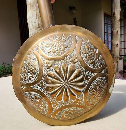 A VINTAGE ISLAMIC BRASS GUN POWDER FLASK