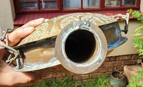 A VINTAGE ISLAMIC BRASS GUN POWDER FLASK