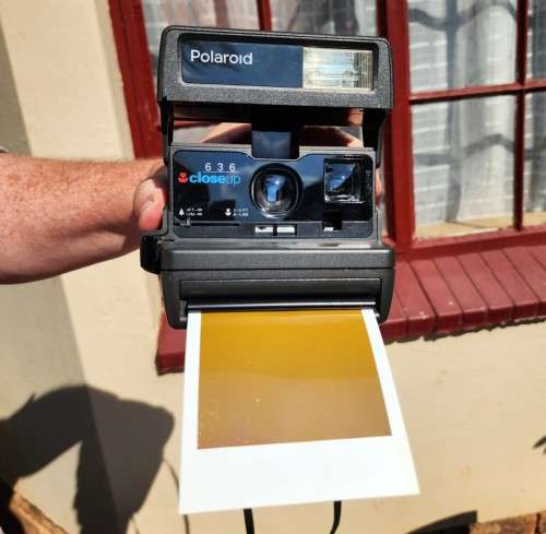 POLAROID 636 CLOSE-UP INSTANT CAMERA BOXED WITH OLD FILM CARTRIDGE AND TWO EXPOSED FILM SLIDES