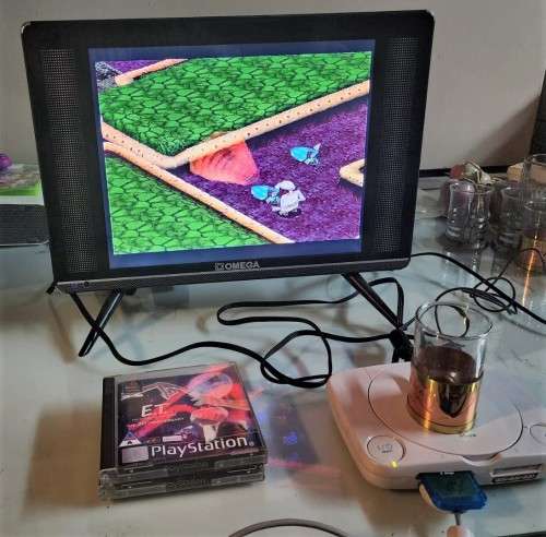 A MIGHTY PS ONE BUNDLE WORKING: CONSOLE WITH DUAL SHOCK CONTROLLER, MEMORY CARD AND TWO GAMES