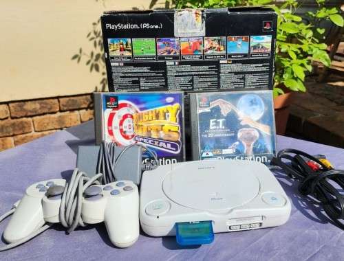 A MIGHTY PS ONE BUNDLE WORKING: CONSOLE WITH DUAL SHOCK CONTROLLER, MEMORY CARD AND TWO GAMES