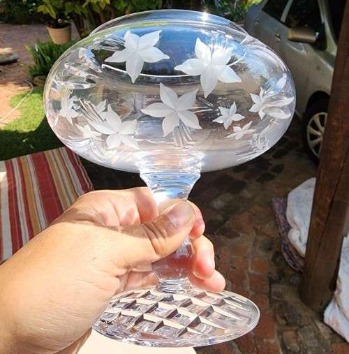 A RINGING AND SINGING CHRYSTAL CUT GLASS ROSE BOWL BY ROYAL DOULTON