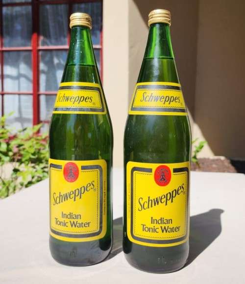 FIGHTING MALARIA WITH TWO FULL VINTAGE GLASS BOTTLES OF SCHWEPPES INDIAN TONIC WATER