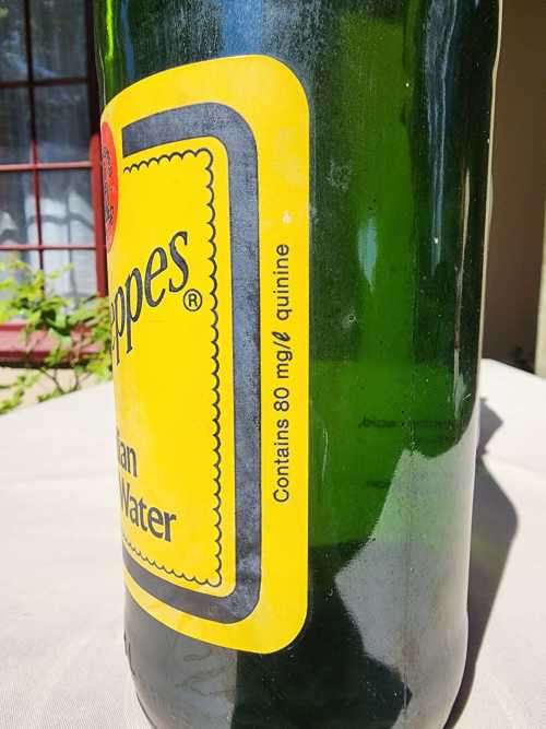 FIGHTING MALARIA WITH TWO FULL VINTAGE GLASS BOTTLES OF SCHWEPPES INDIAN TONIC WATER
